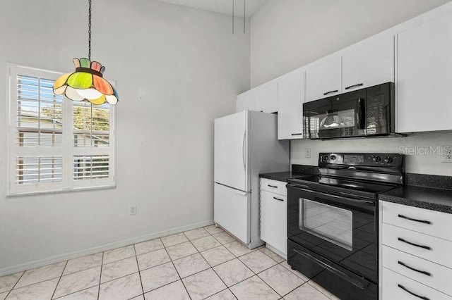 kitchen featuring baseboards, black appliances, white cabinetry, dark countertops, and decorative light fixtures