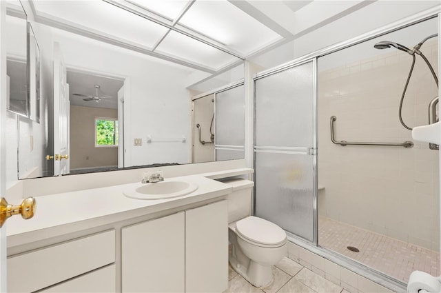 bathroom with a stall shower, toilet, and vanity