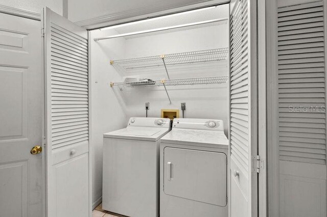 laundry area featuring independent washer and dryer and laundry area