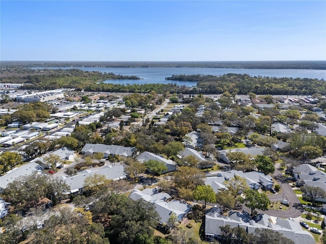 drone / aerial view with a water view and a residential view