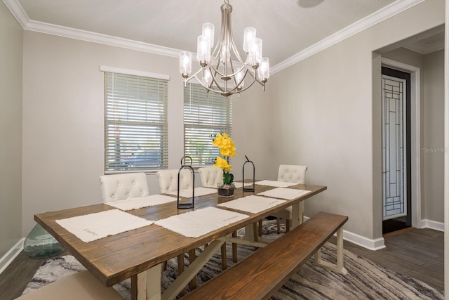 dining space with ornamental molding and wood finished floors