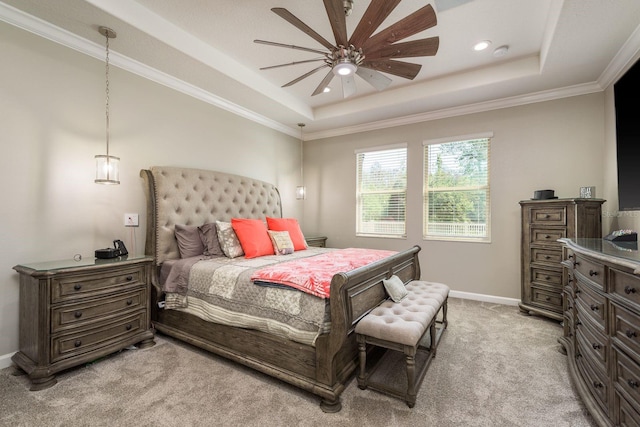 bedroom featuring light carpet, a tray ceiling, recessed lighting, crown molding, and baseboards