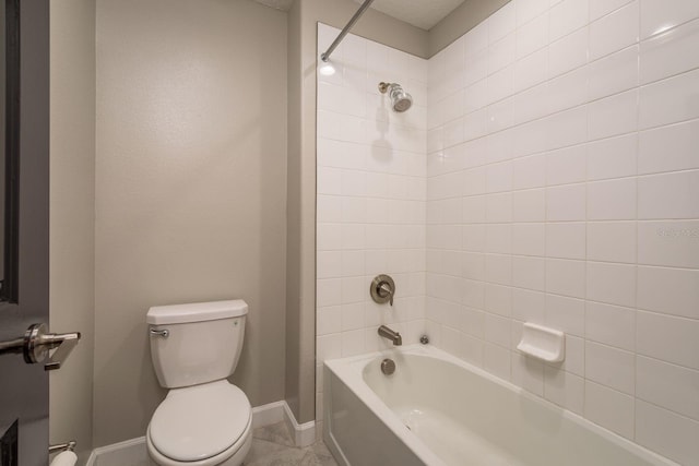 full bathroom featuring  shower combination, toilet, and baseboards