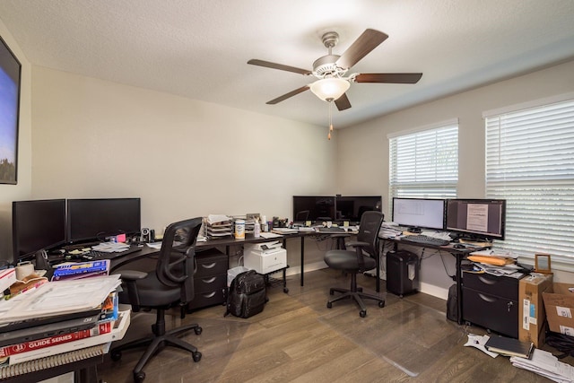 home office featuring wood finished floors, baseboards, and ceiling fan