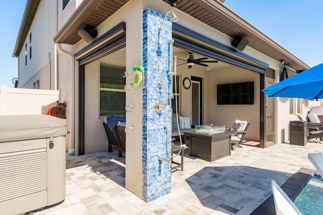 view of patio / terrace featuring outdoor dining space, a ceiling fan, and fence