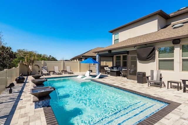 view of pool with a fenced backyard, a fenced in pool, and a patio