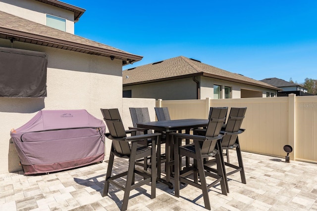 view of patio / terrace featuring outdoor dining area and fence