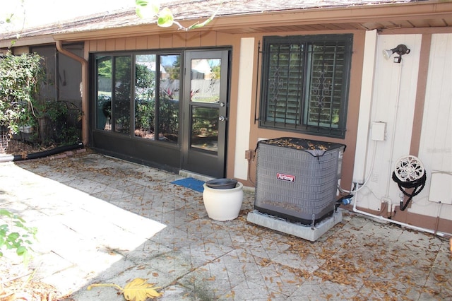 doorway to property with cooling unit