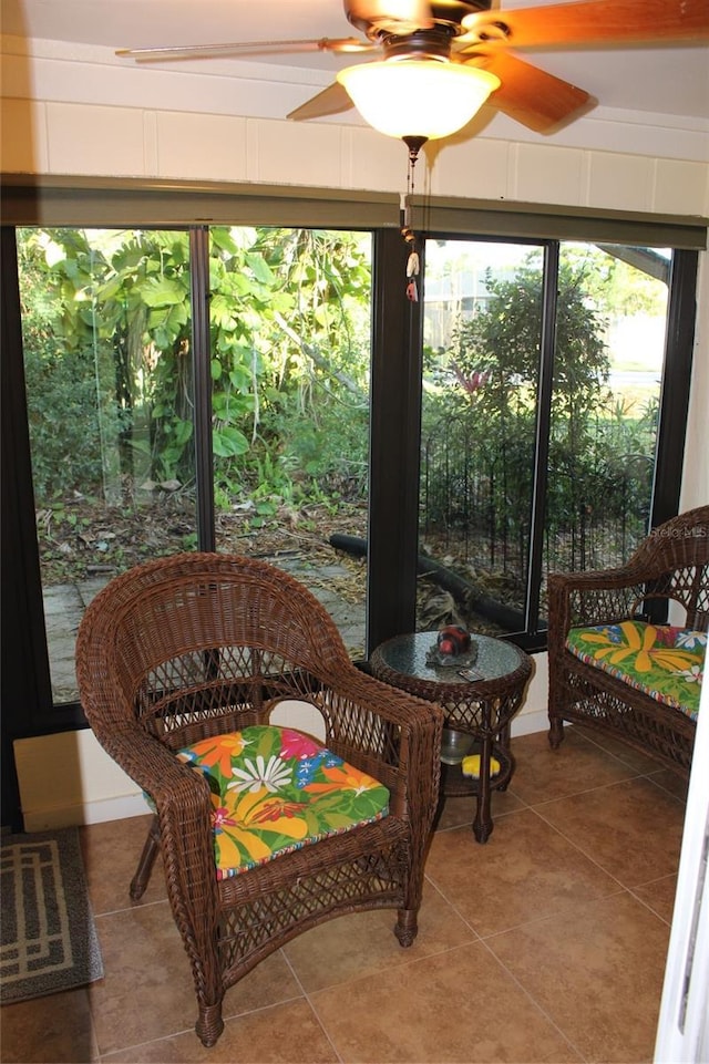 sunroom / solarium with ceiling fan