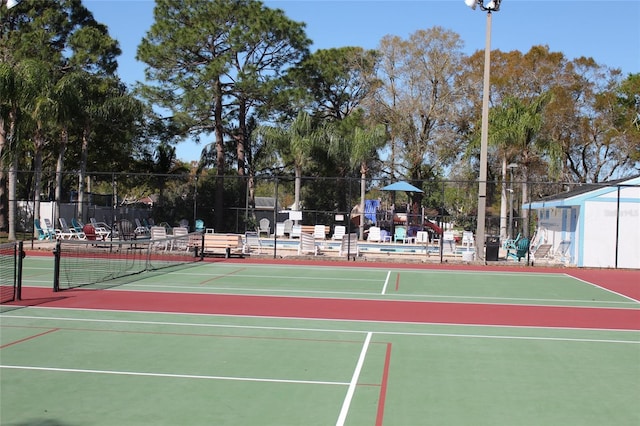 view of sport court with fence