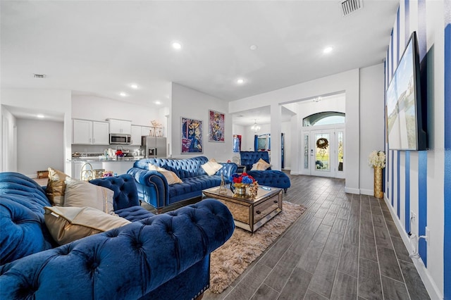 living area featuring visible vents, recessed lighting, baseboards, and wood tiled floor