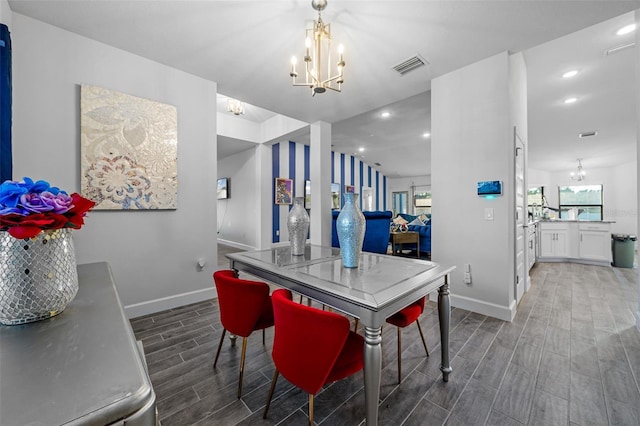 kitchen featuring a notable chandelier, baseboards, visible vents, and wood tiled floor