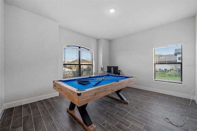 game room featuring baseboards, a wealth of natural light, and wood tiled floor