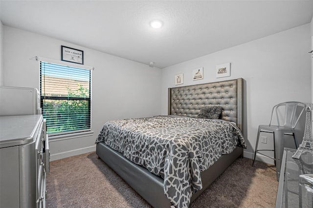 carpeted bedroom featuring baseboards