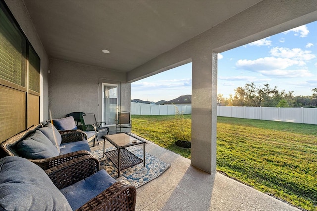 view of patio with an outdoor living space and a fenced backyard