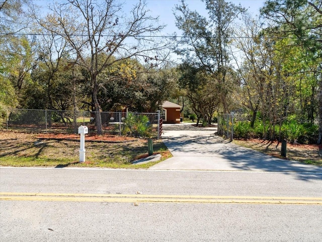 view of street featuring aphalt driveway