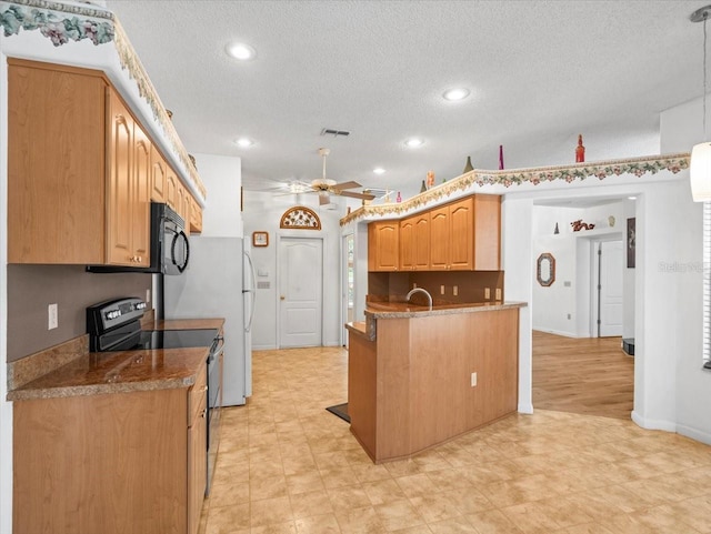 kitchen with visible vents, range with electric cooktop, ceiling fan, and a textured ceiling