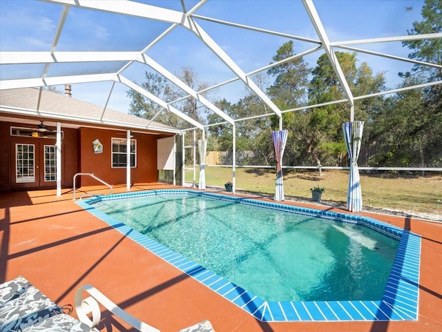 pool with a lanai, french doors, a ceiling fan, and a patio