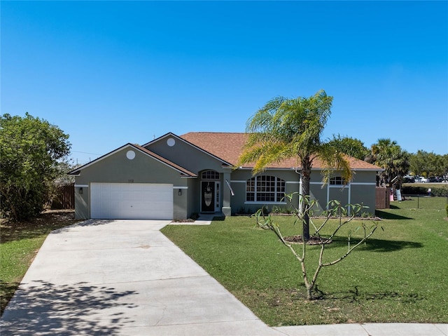 ranch-style house with stucco siding, driveway, an attached garage, and a front yard