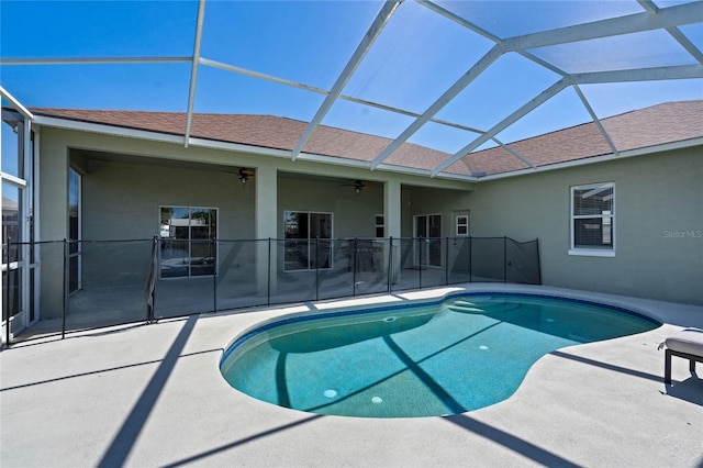 view of pool with a lanai, a fenced in pool, a patio, and ceiling fan