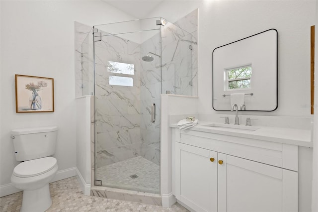 bathroom with a marble finish shower, a healthy amount of sunlight, toilet, and baseboards