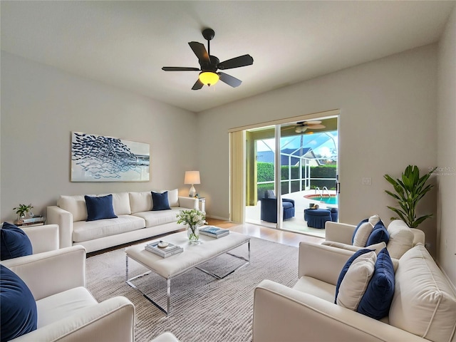 living room featuring wood finished floors and a ceiling fan