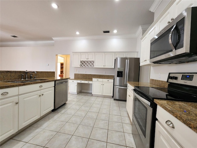 kitchen featuring white cabinetry, appliances with stainless steel finishes, and a sink