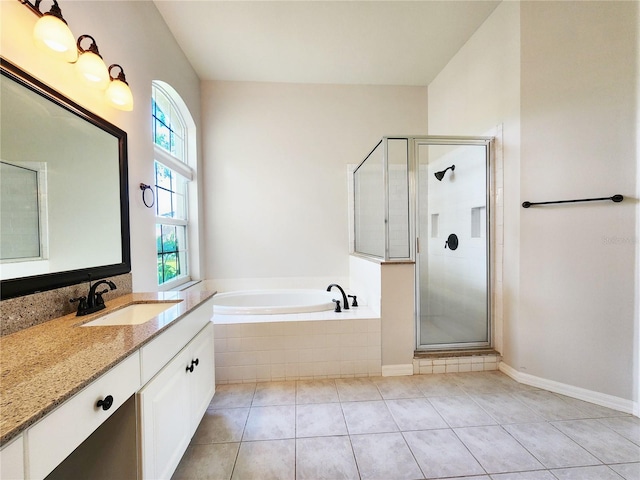 full bath with vanity, a bath, a shower stall, and tile patterned flooring