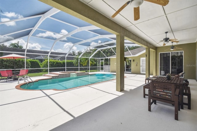 view of swimming pool featuring a pool with connected hot tub, a lanai, a ceiling fan, and a patio area