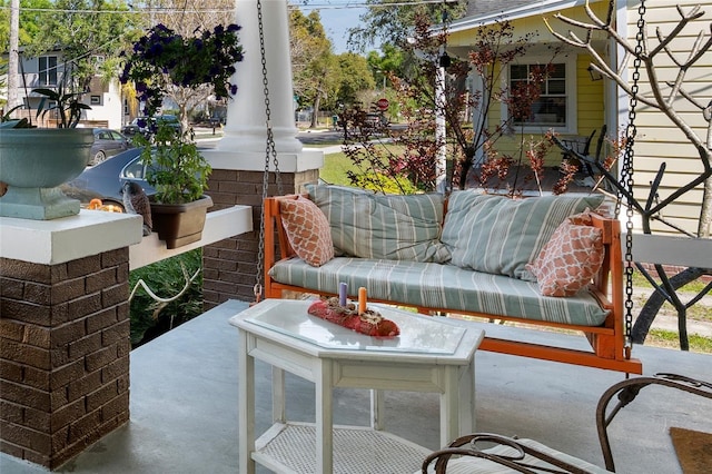 view of patio featuring a porch