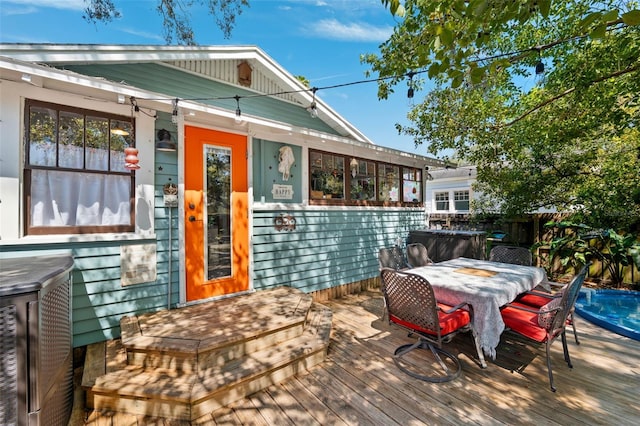 deck with outdoor dining space