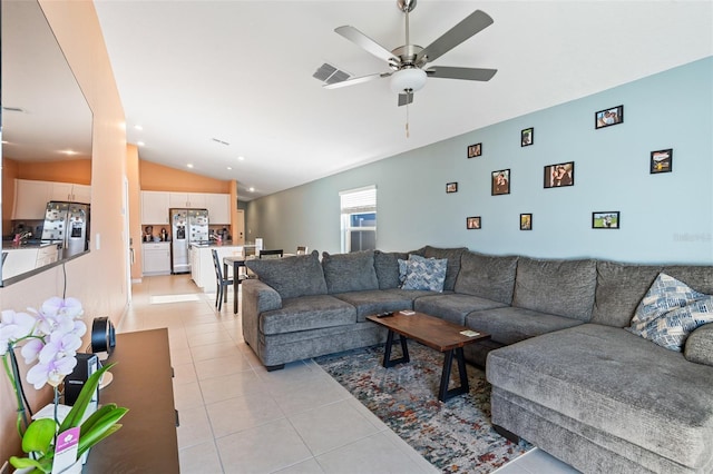 living area featuring light tile patterned floors, visible vents, recessed lighting, ceiling fan, and vaulted ceiling