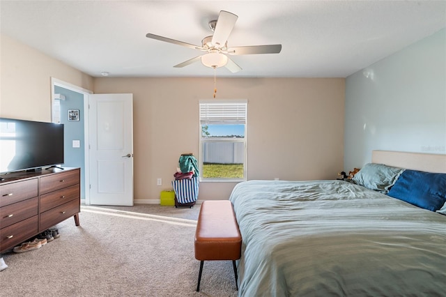 bedroom featuring baseboards, a ceiling fan, and carpet floors