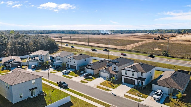 birds eye view of property featuring a residential view and a rural view