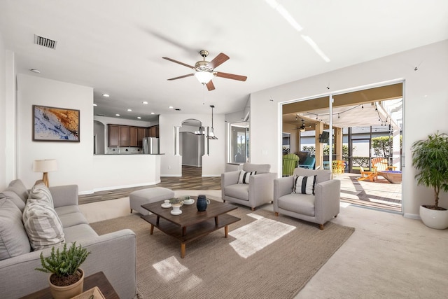 living room with recessed lighting, visible vents, baseboards, and a ceiling fan