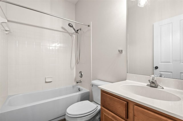 bathroom with shower / bathtub combination, toilet, and vanity