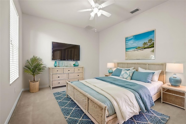 bedroom featuring visible vents, light carpet, baseboards, and ceiling fan