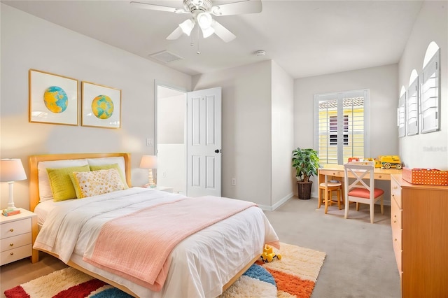 bedroom with baseboards, light carpet, visible vents, and ceiling fan