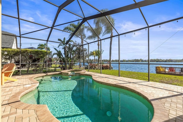 view of swimming pool featuring a patio area, a lanai, a pool with connected hot tub, and a water view