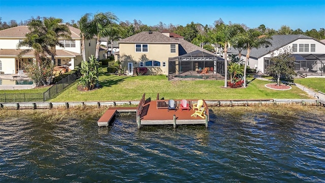 dock area featuring a lanai, a lawn, a water view, and a residential view