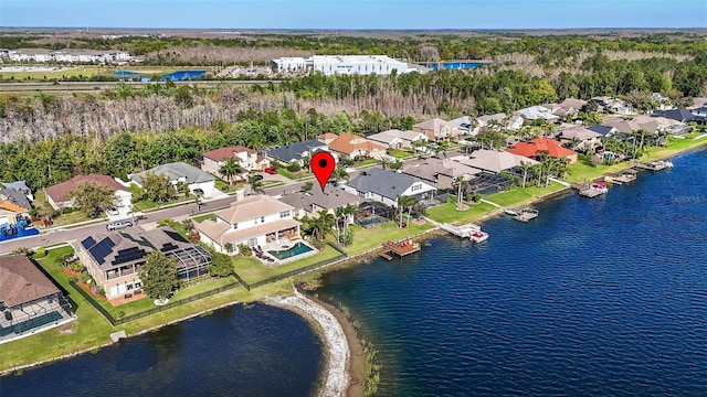 bird's eye view featuring a residential view and a water view