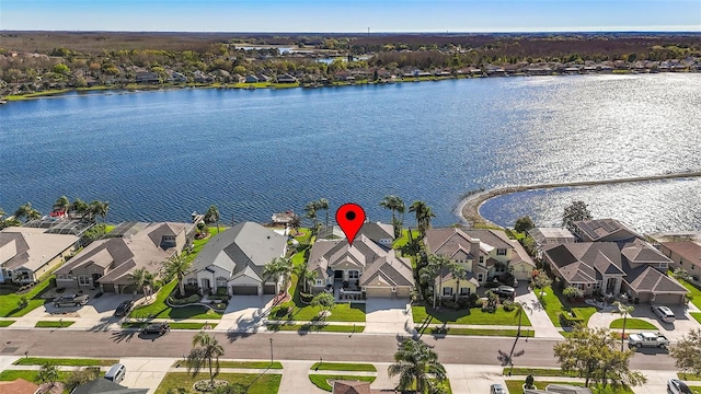 bird's eye view featuring a residential view and a water view