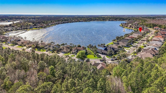 drone / aerial view featuring a residential view and a water view