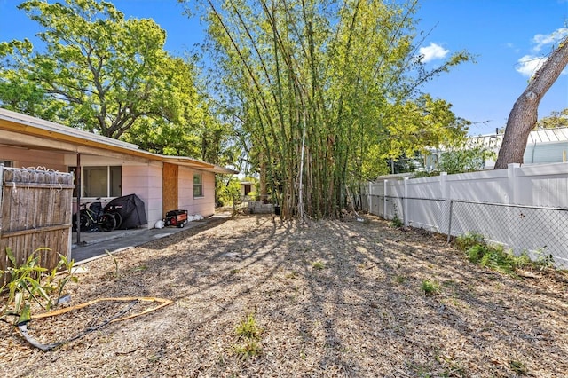 view of yard featuring fence