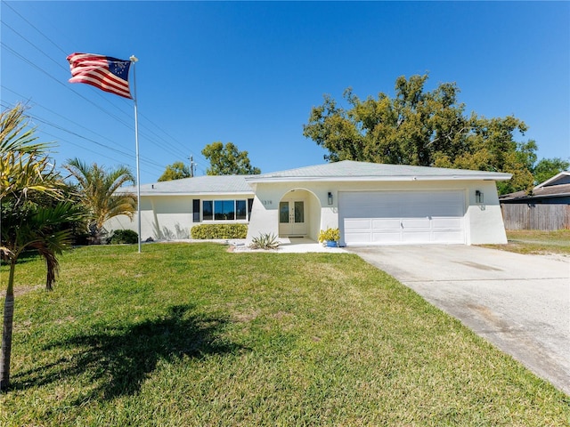 ranch-style home with stucco siding, driveway, fence, a front yard, and a garage