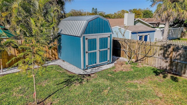 view of shed with a fenced backyard