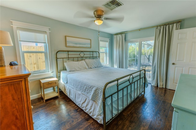 bedroom featuring a ceiling fan, dark wood-type flooring, baseboards, and visible vents