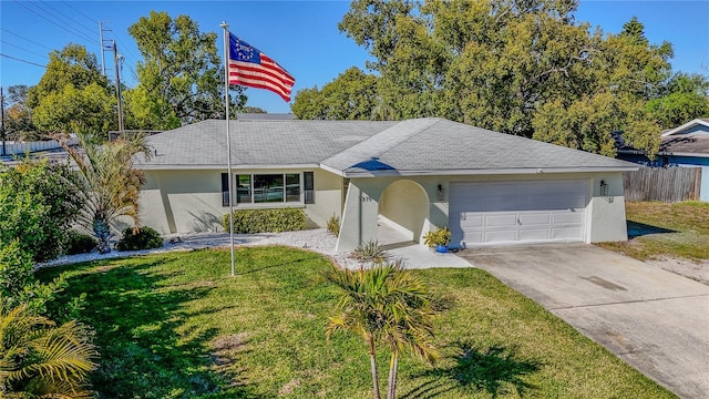 ranch-style home with stucco siding, a garage, concrete driveway, and a front yard