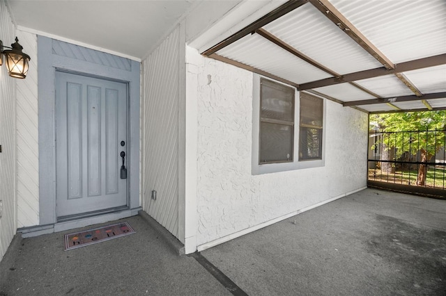 entrance to property with stucco siding