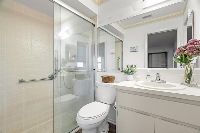 full bathroom with visible vents, vanity, toilet, and a shower stall